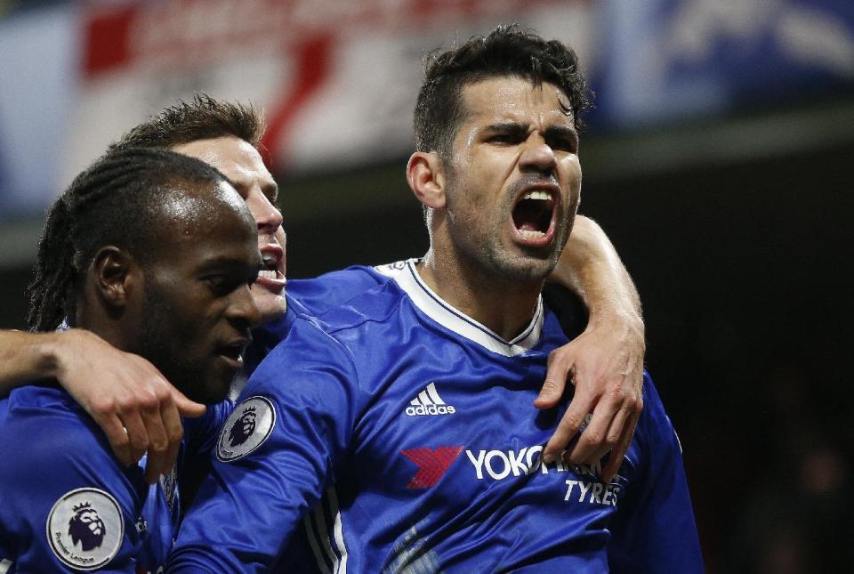 Chelsea's Diego Costa celebrates with teammates after scoring during the English Premier League soccer match between Chelsea and Hull City at Stamford Bridge stadium in London, Sunday, Jan. 22, 2017. (AP Photo/Frank Augstein)