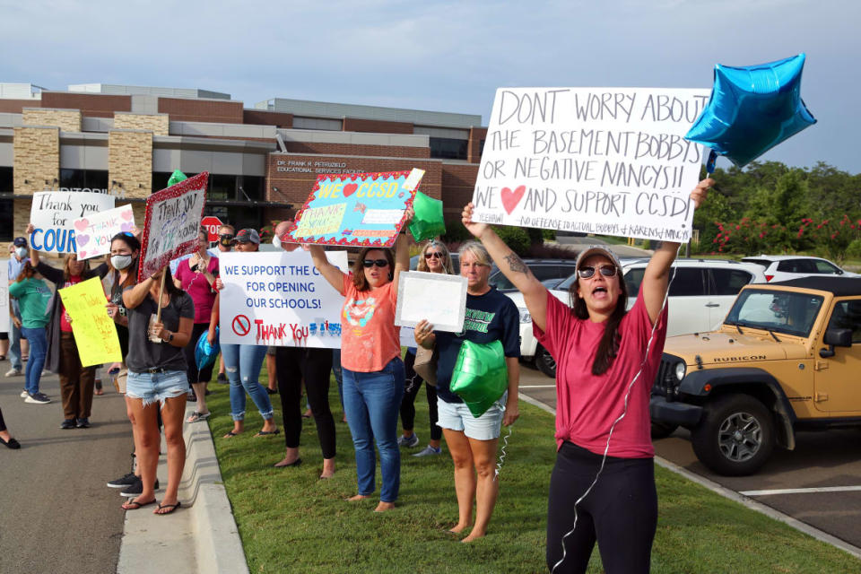 <div class="inline-image__caption"><p>Supporters of the Cherokee County School District's decision to reopen schools rallied outside the district's headquarters earlier this month. </p></div> <div class="inline-image__credit">Dustin Chambers/Reuters</div>