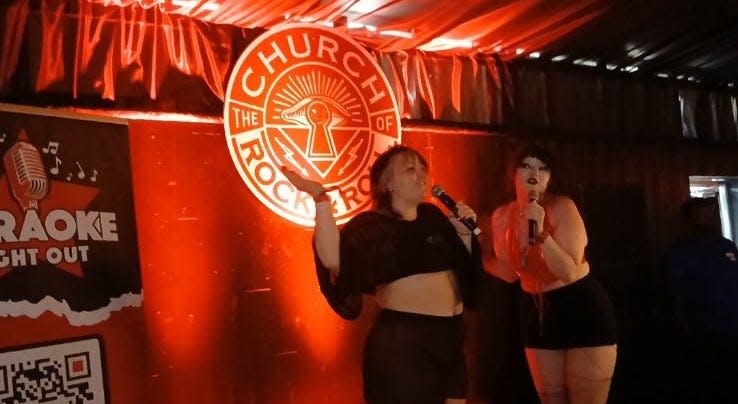From left, Courtney Coon and Alli Bogdan sing Radiohead's "Creep" at the Church of Rock & Roll karaoke dive bar at Welcome to Rockville on Saturday, May 11, 2024.