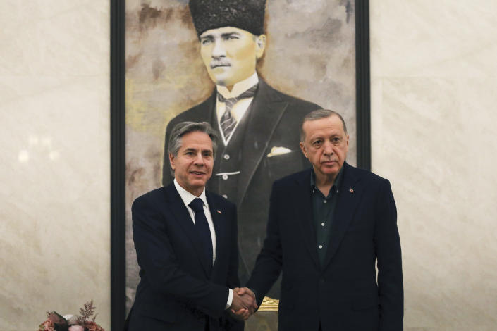 U.S. Secretary of State Antony Blinken, left, shakes hands with Turkish President Recep Tayyip Erdogan during their meeting at Esenboga airport in Ankara, Turkey, Monday, Feb. 20, 2023. Blinken is on his first trip to NATO ally Turkey since he was appointed two years ago. (AP Photo/Burhan Ozbilici, Pool)