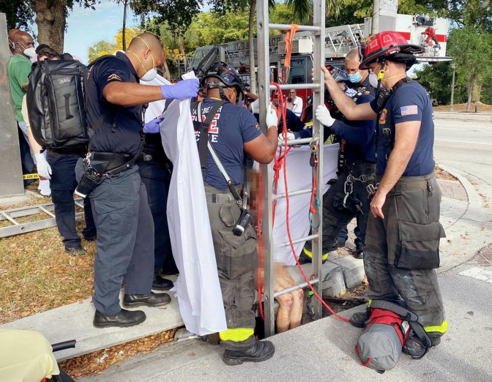 A naked woman was rescued Tuesday after she was found trapped inside a storm drain just a few feet away from a busy Delray Beach road, police and fire rescue said.