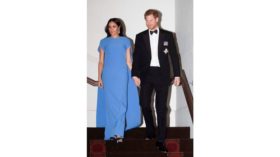 Meghan, Duchess of Sussex in blue cape dress