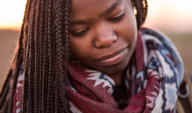 girl looking down crying