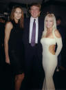 <p>Donald Trump is flanked by his date, model Melania Knauss, and Jaime Bergman at a party celebrating <em>Playboy</em> magazine’s 45th anniversary at the Life Club in New York City on Dec. 3, 1998. (Photo: Richard Corkery/NY Daily News Archive via Getty Images) </p>