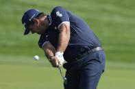 Patrick Reed of the U.S. plays his second shot on the 9th hole during the final round of the Dubai Desert Classic, in Dubai, United Arab Emirates, Monday, Jan. 30, 2023. (AP Photo/Kamran Jebreili)