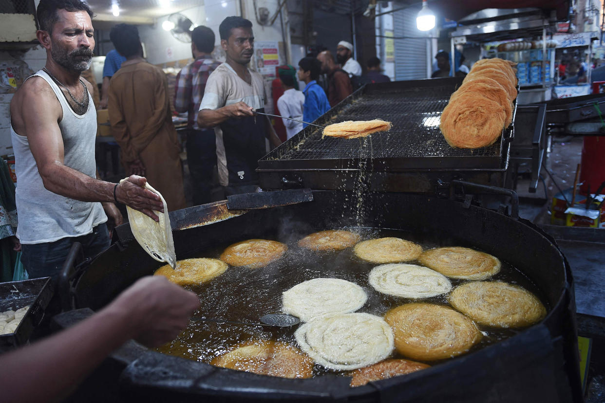 Workers fry vermicelli, a special delicacy prepared for Ramadan, in Karachi, Pakistan. (Rizwan Tabassum / AFP - Getty Images)