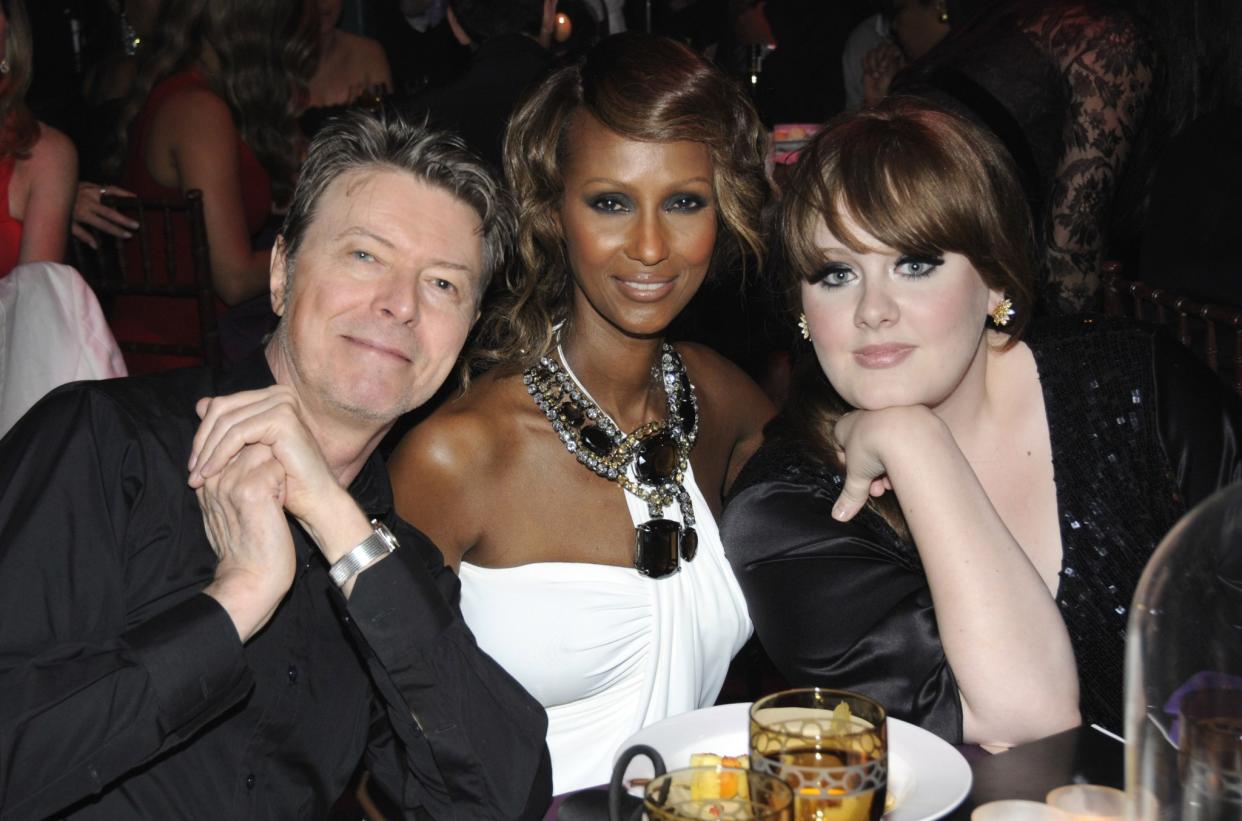 David Bowie and his wife, Iman, with Adele in 2008. (Photo by Kevin Mazur/WireImage)
