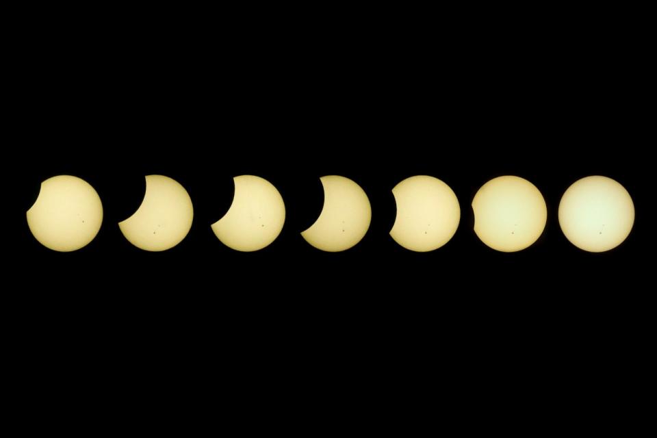 PHOTO: This combined photo shows the process of the partial solar eclipse observed at the University of the Philippines in Quezon City, the Philippines, April 20, 2023. (Rouelle Umali/Xinhua via Getty Images)