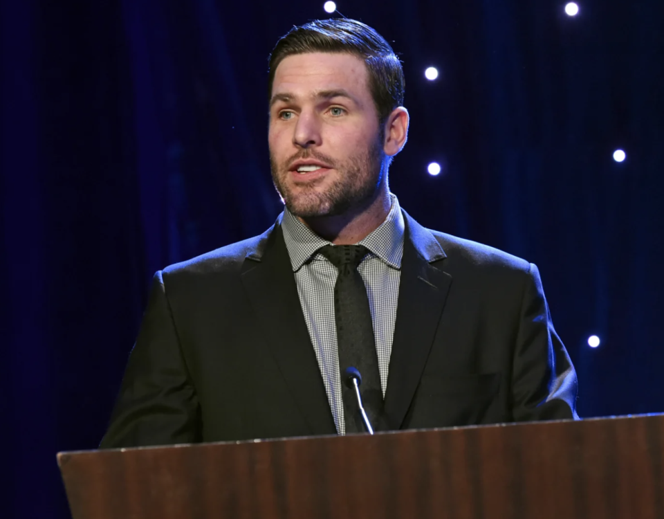 Carrie Underwood's husband Mike Fisher at a podium