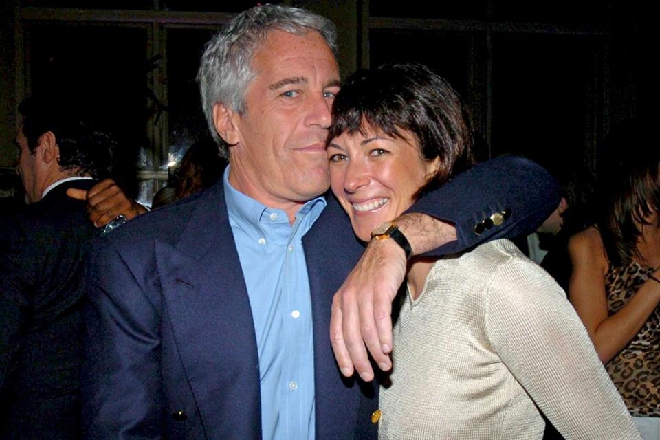 Jeffrey Epstein and Ghislaine Maxwell at a party togetherGetty