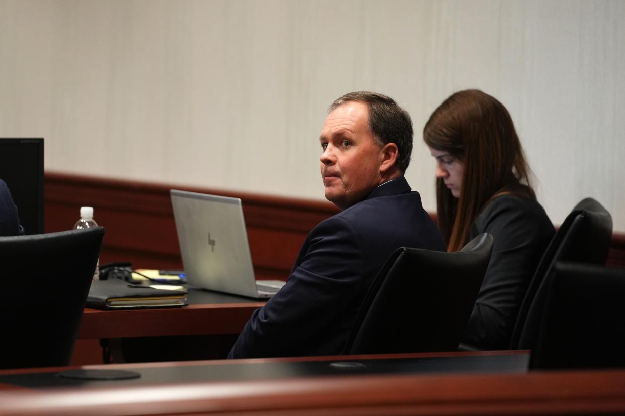 Butler County Auditor Roger Reynolds watches as the jury pool enters the courtroom for jury selection, Monday, Dec. 12, 2022, in Butler County Common Pleas court in Hamilton, Ohio. Reynolds faces six charges related to public corruption.