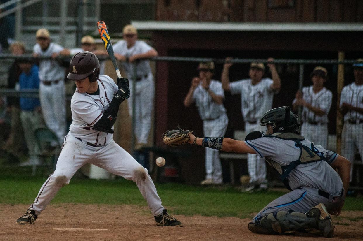 Arlington's Liam Suozzo gets hit by the pitch with the bases loaded, driving in the winning run in the seventh inning against John Jay in an April 30, 2024 baseball game.