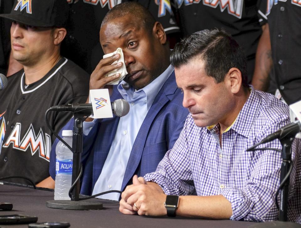 <p>Michael Hill, Marlins president of baseball operations, wipes his tears during a press conference to announce the death of Marlins pitcher Jose Fernandez. Fernandez, the ace right-hander for the Miami Marlins who escaped Cuba to become one of baseball’s brightest stars, was killed in a boating accident early Sunday morning. Fernandez was 24. (AP Photo/Gaston De Cardenas) </p>