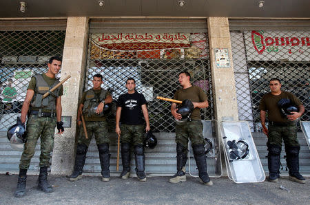 Members of Palestinian security forces take position following clashes with Palestinian youths in the old town of the West Bank city of Nablus August 23, 2016. REUTERS/Abed Omar Qusini