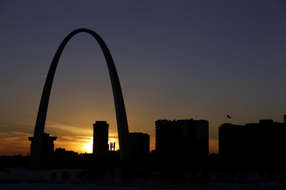 FILE -- In this Jan. 7, 2014 file photo the Gateway Arch dominates the skyline in St. Louis. The iconic Arch, built as a monument to westward expansion, stands 630 feet tall along the banks of the Mississippi River. For a fee, visitors can ride a tram to the top of the Arch and gaze over downtown St. Louis to the west or the cornfields of Illinois to the east, but many attractions at and around the Arch are free. (AP Photo/Jeff Roberson, File)