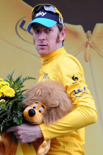 Overall leader's yellow jersey, British Bradley Wiggins, celebrates on the podium at the end of the seventeenth stage of the 2012 Tour de France cycling race starting in Bagneres-de-Luchon and finishing in Peyragudes, southern France. Valverde claimed a stylish solo victory in the 17th stage of the Tour de France as Bradley Wiggins admitted he now feels like a yellow jersey champion