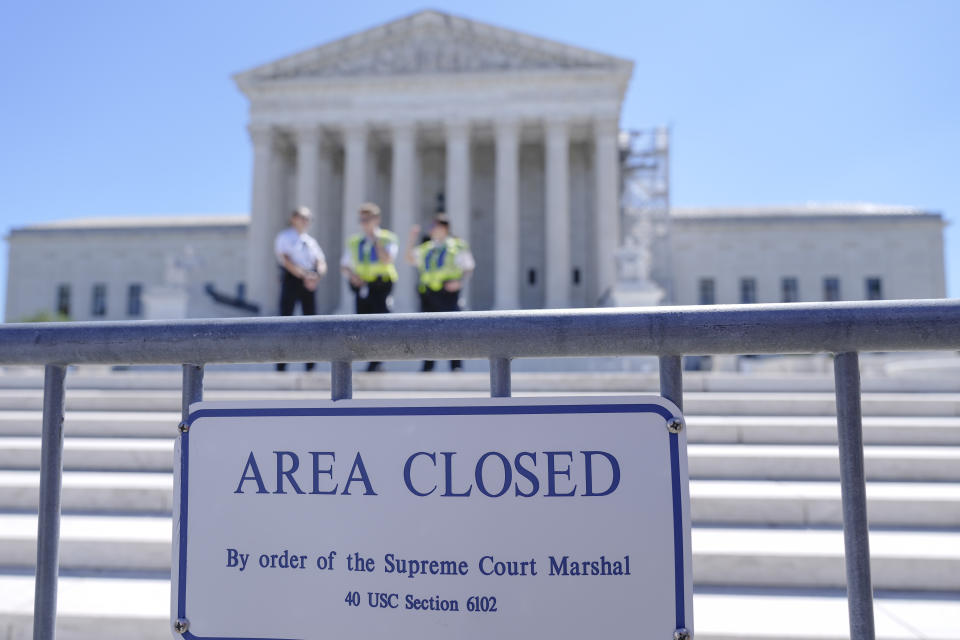 U.S. Supreme Court Police officers stand outside the U.S Supreme Court Monday, July 1, 2024, in Washington. (AP Photo/Mariam Zuhaib)