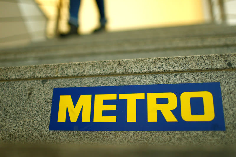 FILE PHOTO: German retailer Metro AG sign is seen on the steps of their headquarters in Duesseldorf, Germany March 02, 2018. REUTERS/Thilo Schmuelgen/File Photo