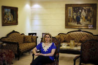 Leila Saleh, wife of Lebanese citizen Mohammed Saleh, who was detained in Greece last week, speaks during an interview at their home in a suburb of the southern port city of Sidon, Lebanon, Tuesday, Sept. 24, 2019. Saleh was detained on suspicion of involvement in the 1985 TWA hijacking and set free after it turned out to be a case of mistaken identity. Saleh is in good health and expected to fly back to Lebanon, he and his wife said Tuesday. (AP Photo/Bilal Hussein)