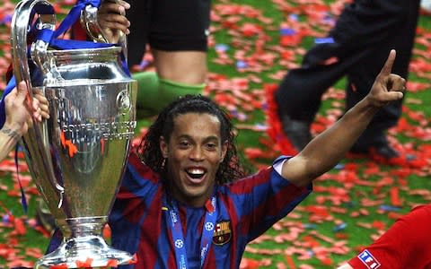 Ronaldinho celebrating with the Champions League trophy in 2006 - Credit: REUTERS
