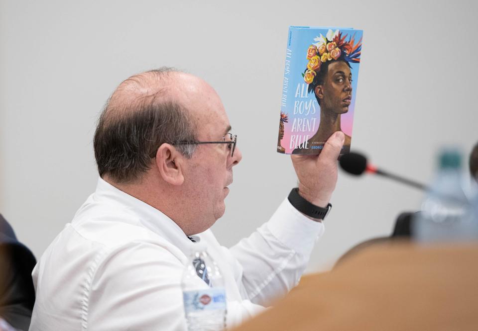 School Board member Kevin Adams makes a statement before voting to ban the book "All Boys Aren't Blue" at the School District of Escambia County meeting in Pensacola on Monday, Feb. 20, 2023. A new bill dictates that school districts must remove any book challenged for sexual material from school shelves within five days.