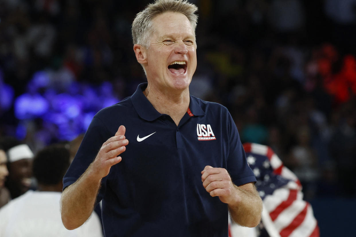 Steve Kerr celebrates after the U.S. men's basketball team defeated France in the gold medal game at the Paris Olympics.