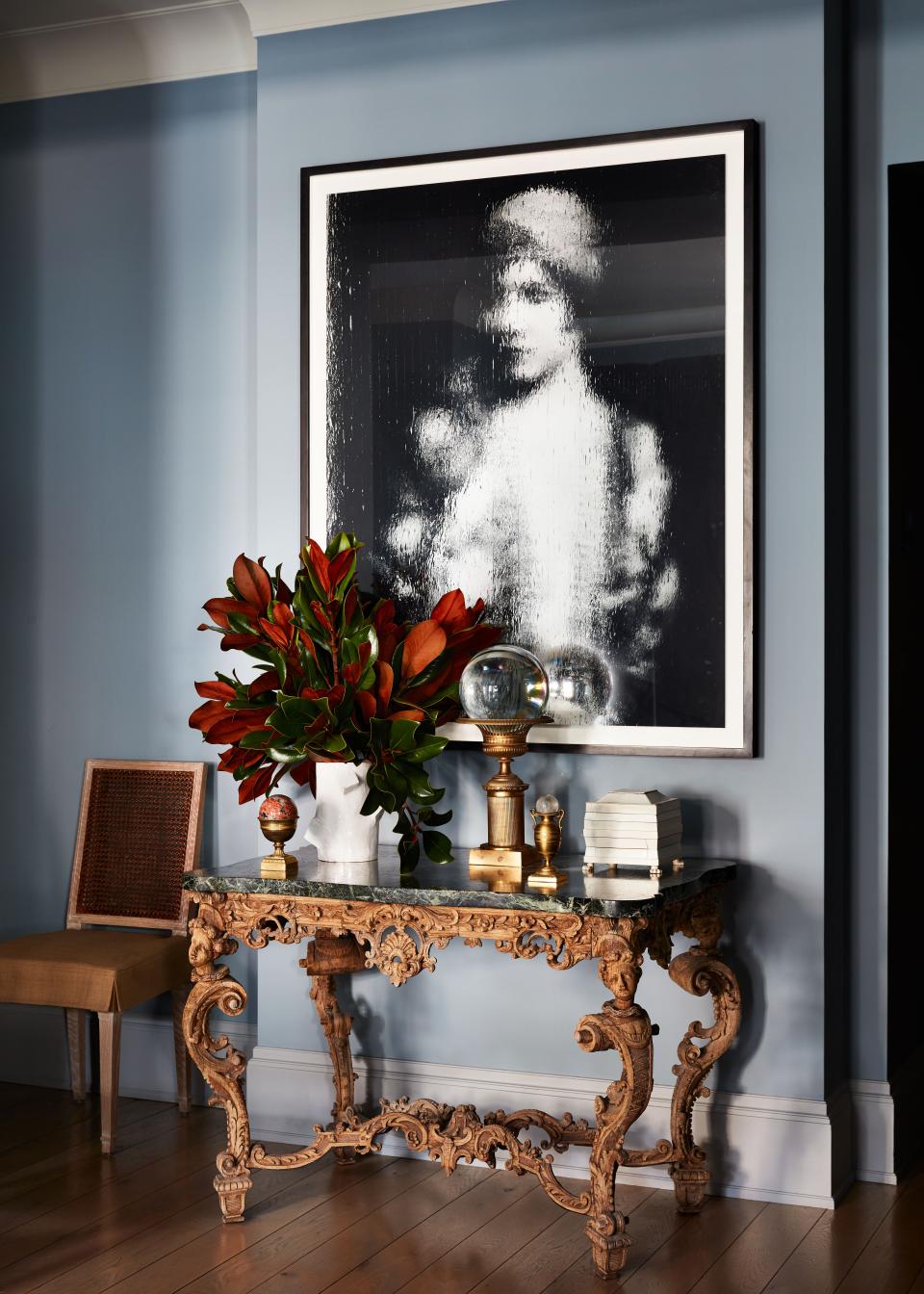 “I love the tension of modern with traditional, the play of periods, the contradictions,” says Nunnerley, referring to a contemporary photo by Gregor Hildebrandt in the entrance hall hanging above a Louis XIV console she bought at auction. “Someone had gilded the console to death but I could see how special the carving was, so I stripped it.”