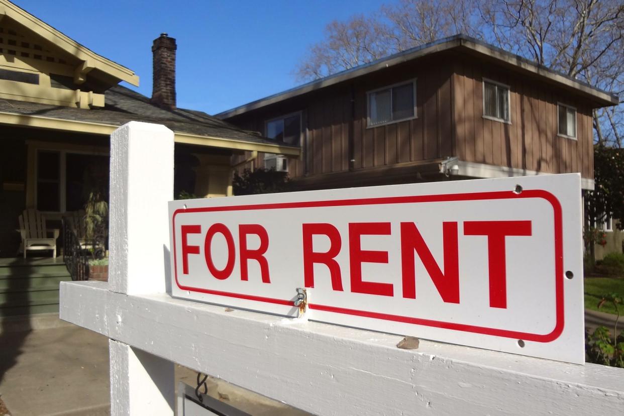 'For Rent' real estate sign outside a home in California