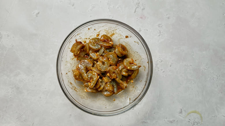 marinating shrimp in glass bowl