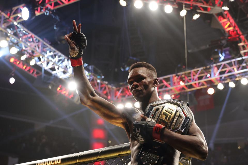 Israel Adesanya celebrates one of his wins.