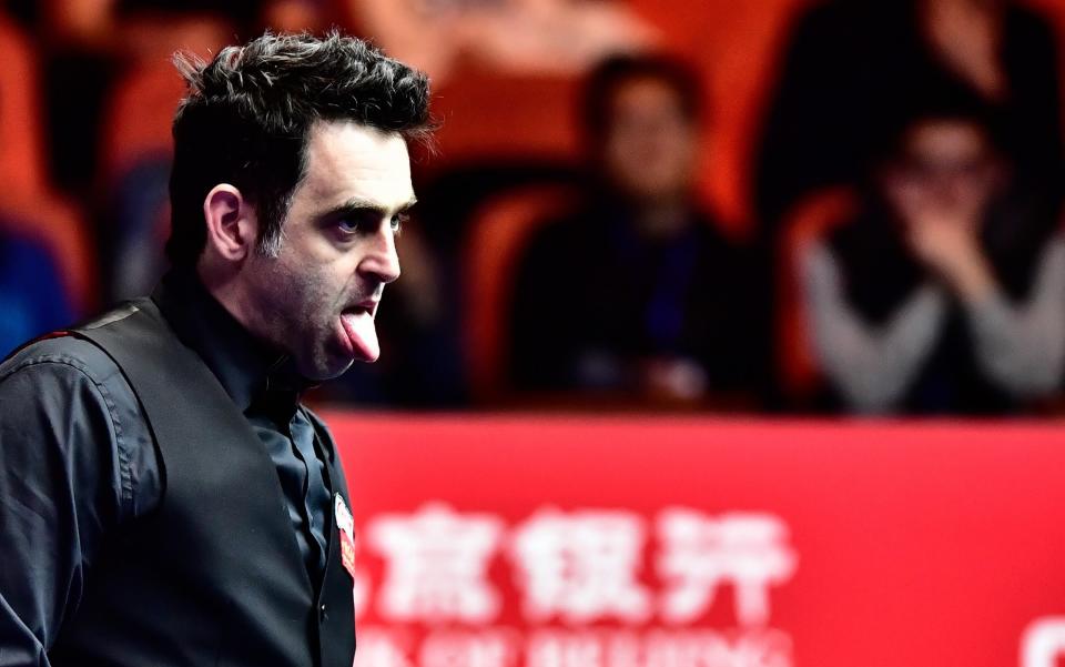 Ronnie O'Sullivan of England reacts as he misses a shot to Mark Joyce of England - Credit: Rex