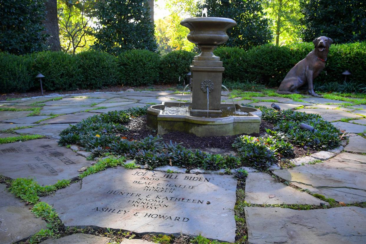 The Bidens added the Family Heritage Garden of the Vice President, where all occupants and their family members, including pets, are memorialized on the stone pavers around a fountain. In this photo from Oct. 28, 2016, a fiberglass replica of a bronze dog by artist Charles Parks is on loan and wears the collar of the Biden's dog, Champ. (Photo: The Washington Post via Getty Images)