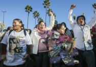 Fans cheer for Jenni Rivera before the start of a memorial service in Universal City in Los Angeles Wednesday, Dec. 19, 2012. The 43-year-old Rivera and six others died Dec. 9 in a crash that remained under investigation. Rivera sold more than 15 million copies of her 12 major-label albums. Her soulful singing style and honesty about her tumultuous personal life won her fans on both sides of the U.S.-Mexico border. She was also an actress and reality-TV star. (AP Photo/Damian Dovarganes)