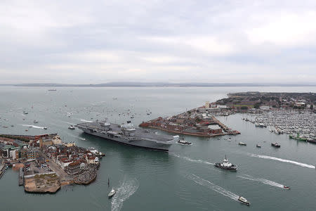 The Royal Navy's new aircraft carrier, HMS Queen Elizabeth, arrives in Portsmouth, Britain August 16, 2017. LPHOT Kyle Heller/Royal Navy/MoD/Crown Copyright/Handout via REUTERS
