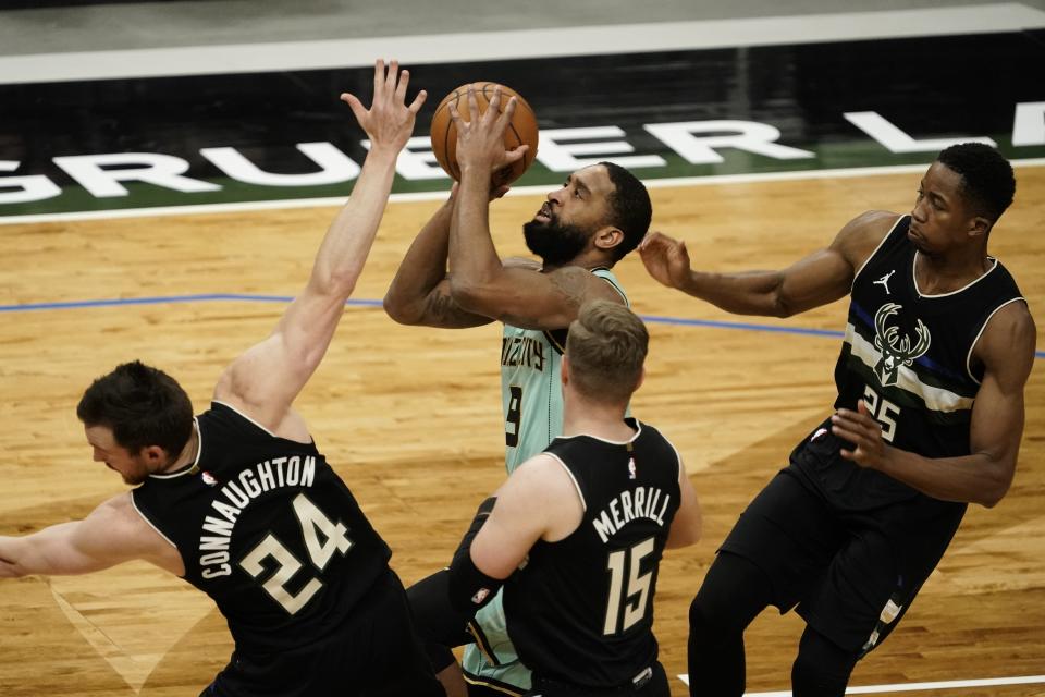 Charlotte Hornets' Brad Wanamaker is fouled as he drives to the basket during the first half of an NBA basketball game against the Milwaukee Bucks Friday, April 9, 2021, in Milwaukee. (AP Photo/Morry Gash)