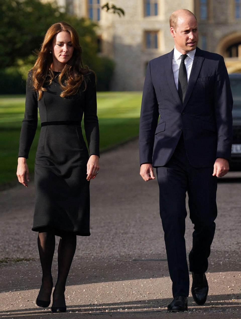 (L-R) Britain's Catherine, Princess of Wales, Britain's Prince William, Prince of Wales on the long Walk at Windsor Castle on September 10, 2022, before meeting well-wishers. - King Charles III pledged to follow his mother's example of "lifelong service" in his inaugural address to Britain and the Commonwealth on Friday, after ascending to the throne following the death of Queen Elizabeth II on September 8. (Photo by Kirsty O'Connor / POOL / AFP) (Photo by KIRSTY O'CONNOR/POOL/AFP via Getty Images)