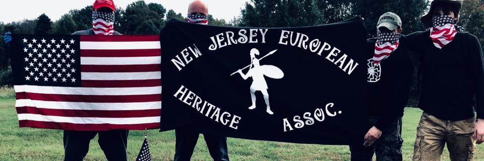 Four members of the New Jersey European Heritage Association pose with American flag bandanas to cover their face. (Credit: Twitter/NJEHA)