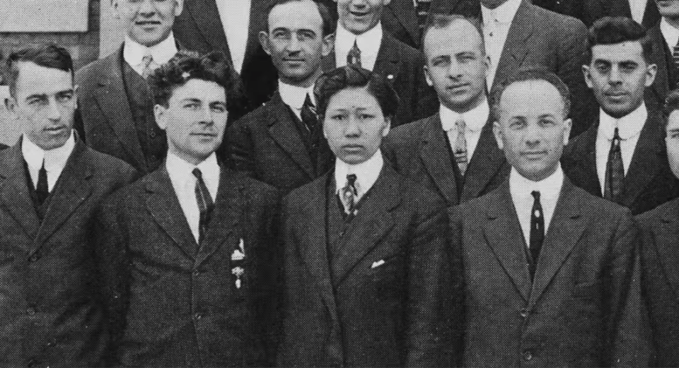 Chung during medical school, surrounded by white men