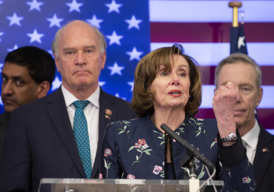 Speaker of the House Nancy Pelosi, D-Calif, center, speaks during a media conference after a meeting at NATO headquarters in Brussels, Monday, Feb. 17, 2020. Speaker of the House Nancy Pelosi is on a one day visit to Brussels to meet with leaders of the EU and NATO. (AP Photo/Virginia Mayo)