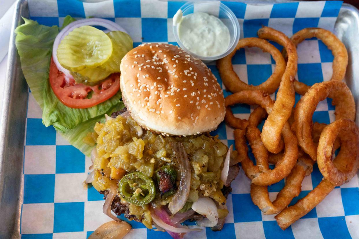 The hulk smash burger at Ichabod's Grille features a ground beef patty topped with pepper jack cheese, jalapeno, green chilies, sautéed onion and served with jalapeno mayo and choice of sides.