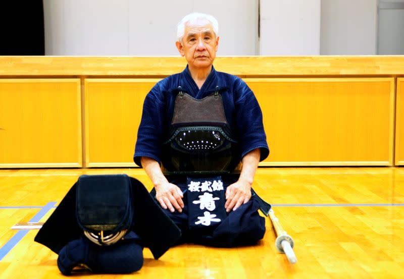 Shigeru Aoki, kendo teacher and torch bearer for the 2020 Tokyo Olympics sits at the gymnasium of a primary school in Fukuoka