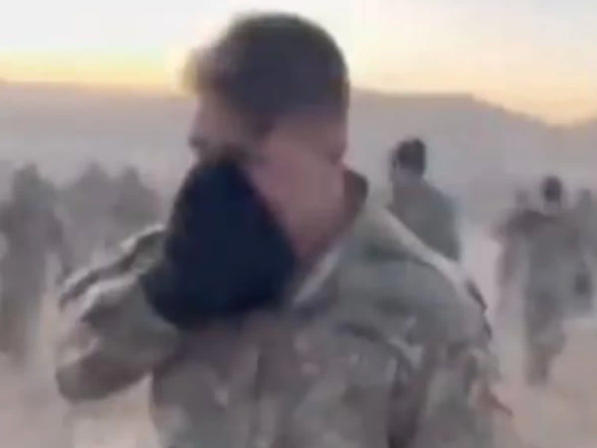 A member of the US Army’s 4th Infantry Division covers his mouth and nose to protect himself from CS gas after the irritant accidentally spread throughout a morale boosting event in Fort Carson, Colorado (Screengrab/TikTok/@Buffcity_)