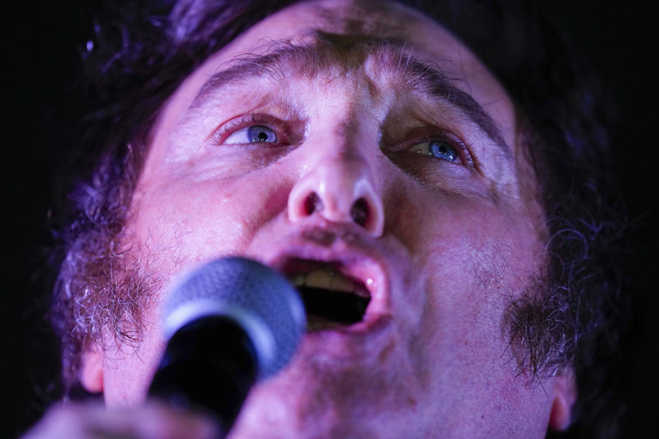 Presidential candidate of the Liberty Advances coalition Javier Milei speaks to supporters outside his campaign headquarters after winning the runoff election in Buenos Aires, Argentina, Sunday, Nov. 19, 2023. (AP Photo/Natacha Pisarenko)