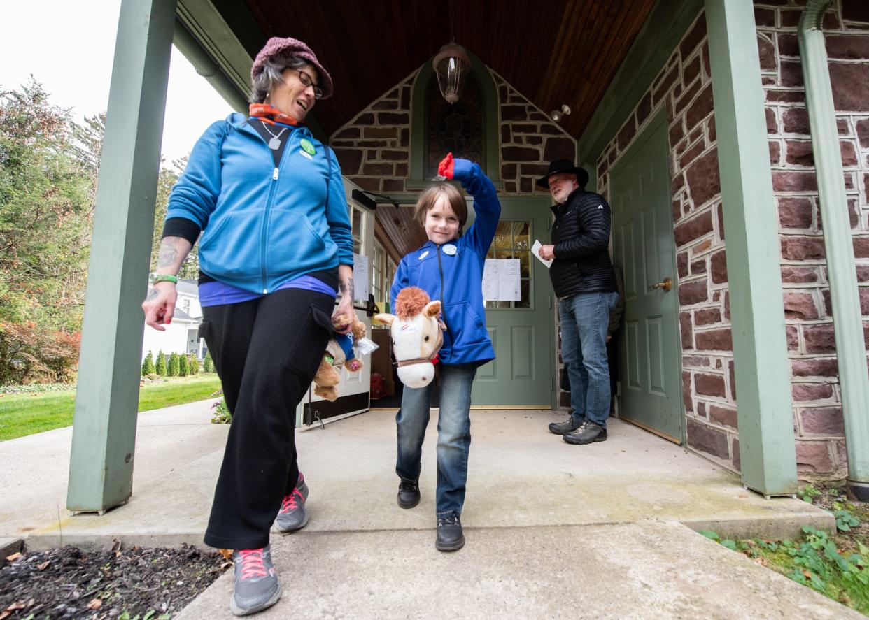 Pauline Miklos, of Doylestown Borough, and her son, Julian, 6, leave Salem United Church of Christ, in Doylestown Borough, after casting a vote during the General Election on Tuesday, Novemeber 7, 2023.