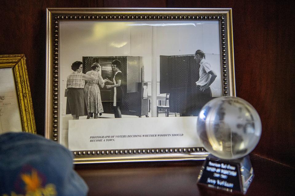 A photograph in Woodfin Mayor Jerry VeHaun’s office shows people voting on whether or not to incorporate Woodfin.