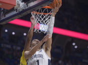 Penn State's Seth Lundy scores on a reverse layup against Michigan during the first half of an NCAA college basketball game, Sunday, Jan. 29, 2023, in State College, Pa. (AP Photo/Gary M. Baranec)