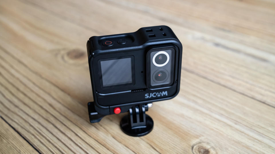 SJCAM SJ20 action camera on a wooden floor