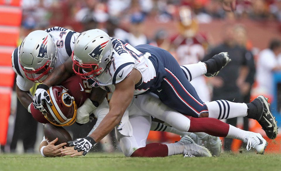 New England Patriots outside linebacker Dont'a Hightower (54) and New England Patriots defensive end Michael Bennett (77) sack Washington Redskins quarterback Colt McCoy (Getty Images)