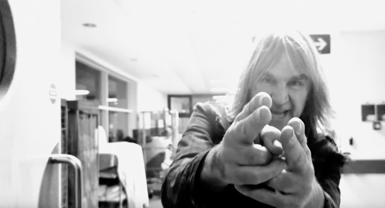 Mike Peters of the Alarm performs at North Wales Cancer Centre in the music video for 