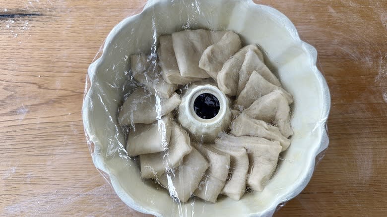 Dough covered to rise in pan